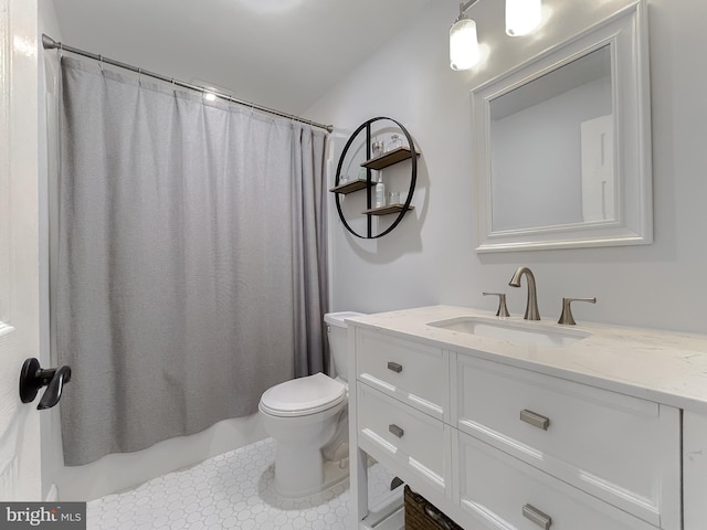 bathroom featuring vanity, toilet, and shower / tub combo with curtain