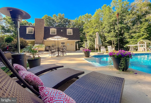 outdoor pool featuring a patio area