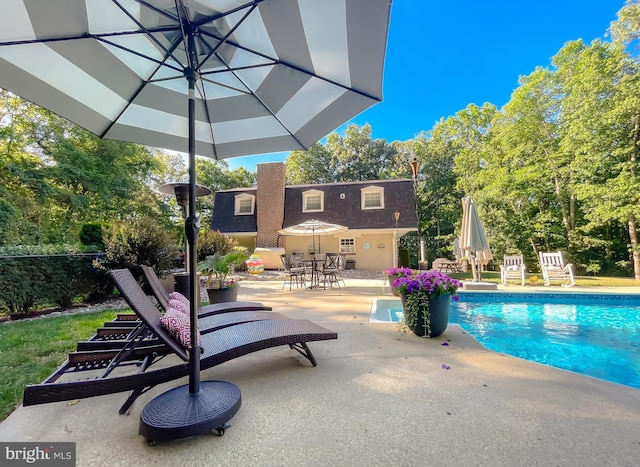 pool featuring a patio area