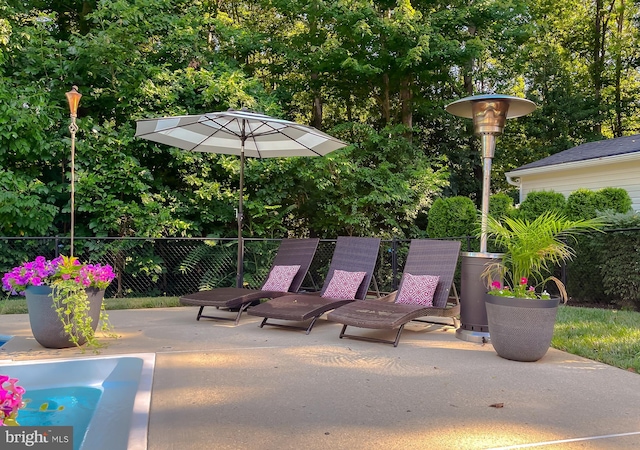 view of patio / terrace featuring fence