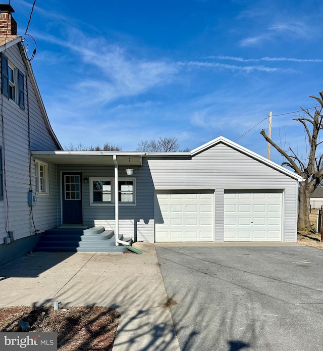 view of front of property featuring driveway and an attached garage