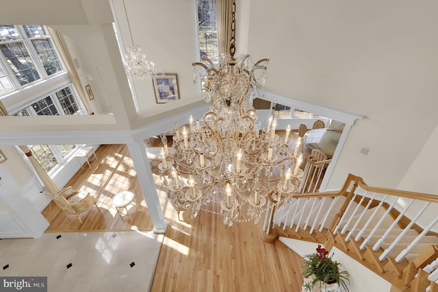 details with a chandelier and wood finished floors