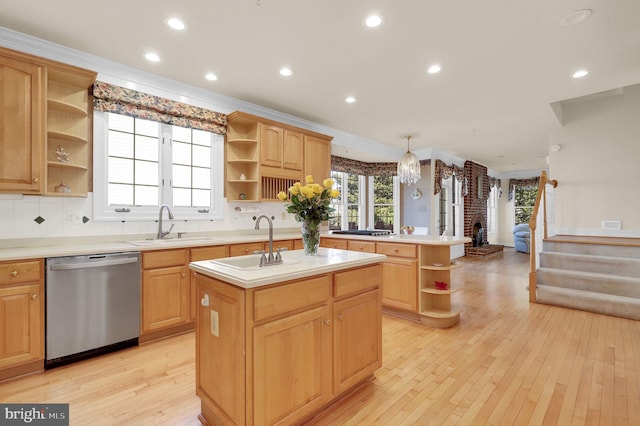 kitchen with a sink, a center island with sink, dishwasher, and open shelves