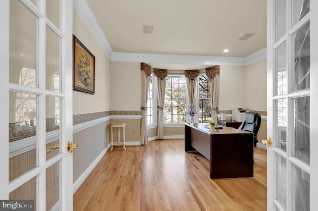 office space with wainscoting, light wood-style flooring, french doors, and ornamental molding