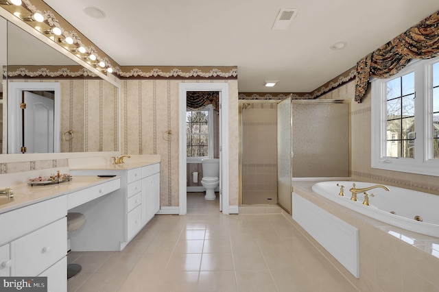 full bathroom featuring plenty of natural light, toilet, a stall shower, and wallpapered walls