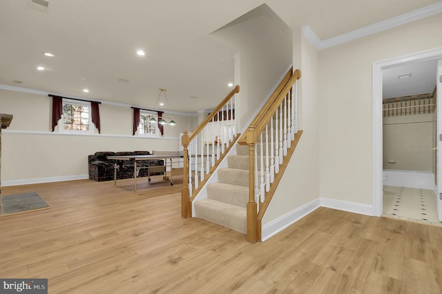 stairs featuring recessed lighting, ornamental molding, baseboards, and wood finished floors