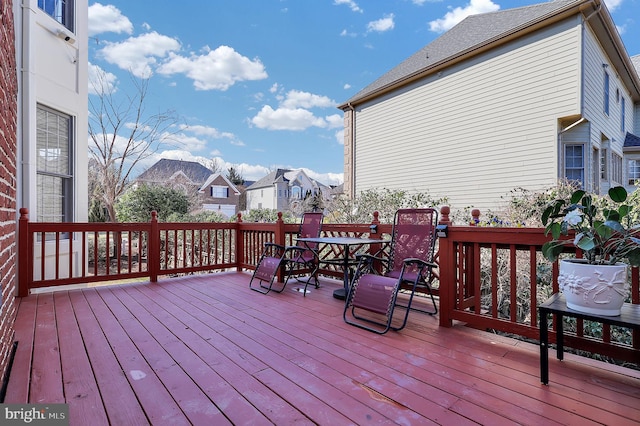 wooden terrace with outdoor dining area