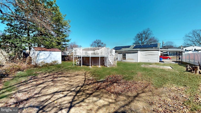 view of yard featuring an outbuilding and a storage unit