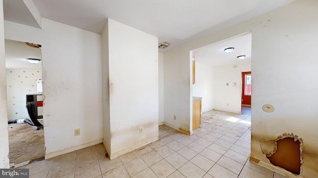 interior space with light tile patterned floors and visible vents