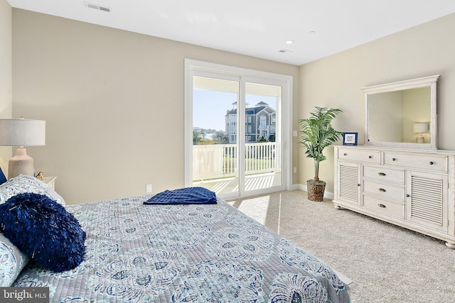 carpeted bedroom featuring access to outside, visible vents, and baseboards