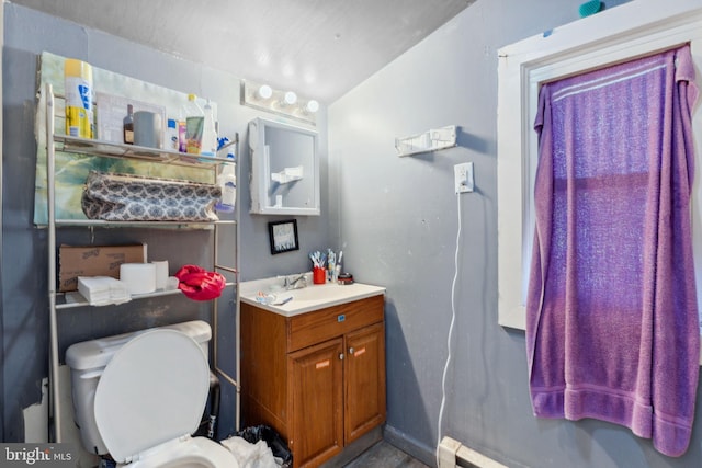 half bath with vanity and toilet