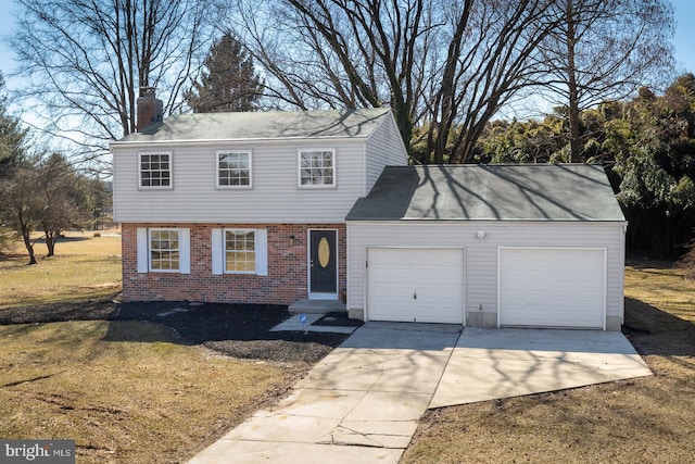 view of front of home featuring an attached garage, brick siding, concrete driveway, a chimney, and a front yard