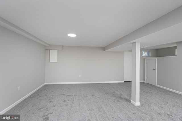 finished below grade area featuring carpet floors and baseboards