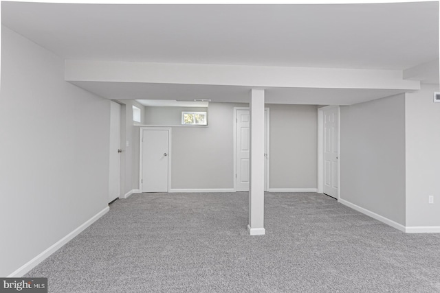 basement with carpet and baseboards