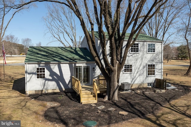 back of property featuring crawl space, a wooden deck, and central AC unit