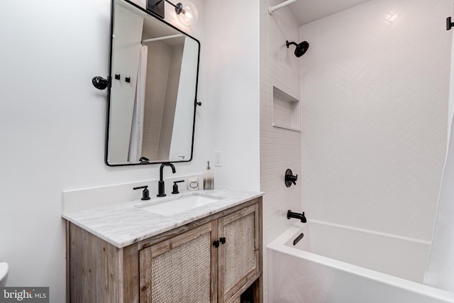 bathroom featuring shower / bath combo with shower curtain and vanity