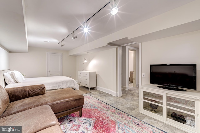 bedroom featuring baseboards