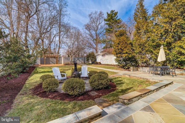 view of yard featuring a patio area and fence