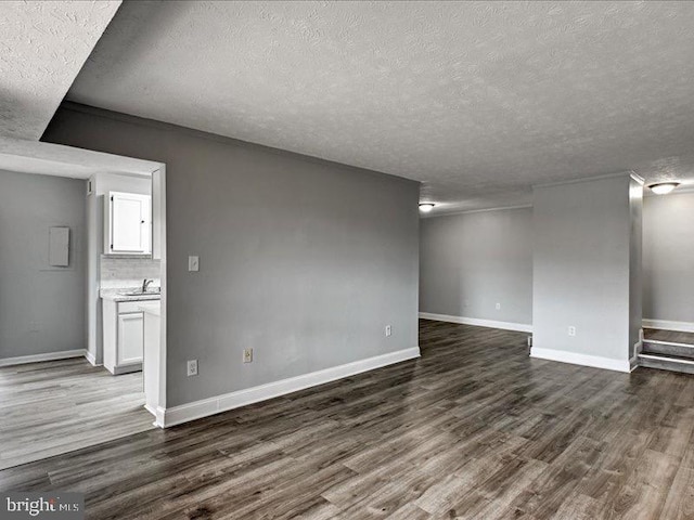 interior space with dark wood-style flooring and baseboards