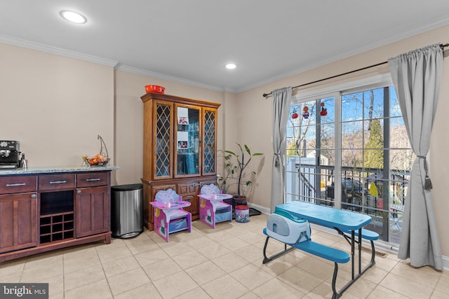 playroom featuring recessed lighting, crown molding, and baseboards