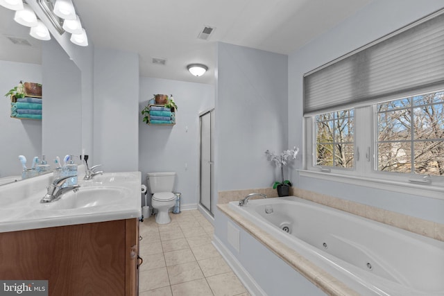 full bathroom featuring double vanity, visible vents, toilet, tile patterned floors, and a sink