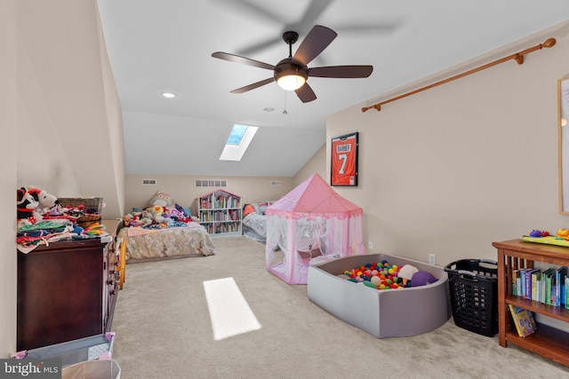 bedroom with carpet floors, recessed lighting, visible vents, lofted ceiling with skylight, and a ceiling fan