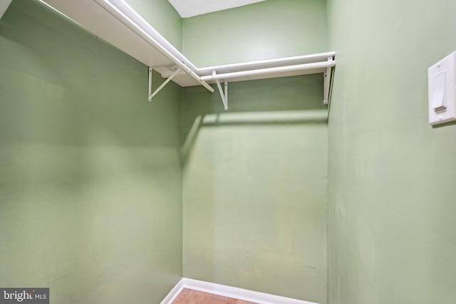 spacious closet with wood finished floors