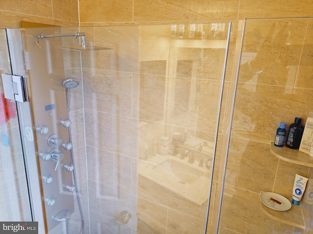 bathroom featuring a shower stall