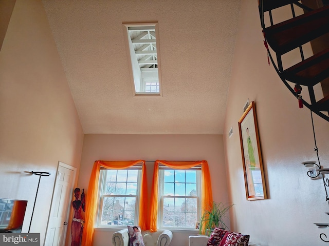 sitting room featuring a textured ceiling