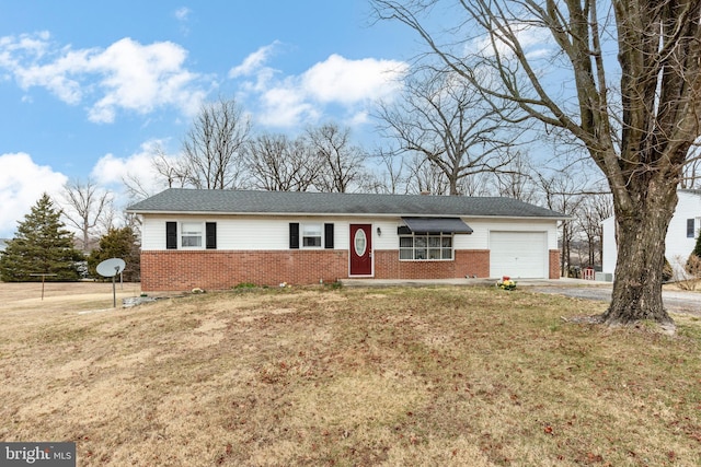 ranch-style house featuring brick siding, concrete driveway, a front lawn, and a garage