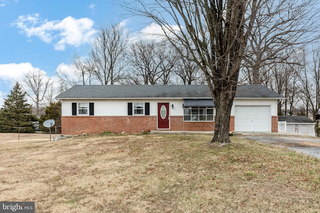 ranch-style house featuring brick siding, a front yard, aphalt driveway, and a garage