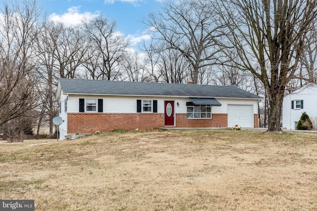 single story home featuring a front yard, brick siding, a chimney, and an attached garage