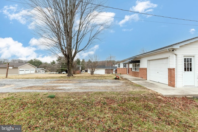 view of yard featuring a garage