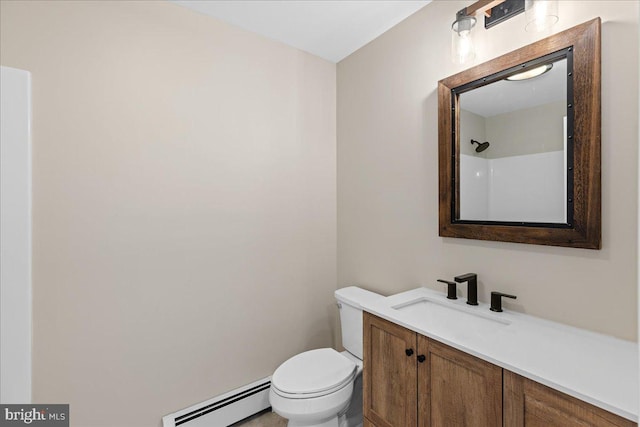 bathroom featuring toilet, a baseboard radiator, and vanity