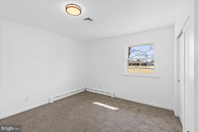 unfurnished bedroom featuring carpet floors, a closet, visible vents, and baseboards