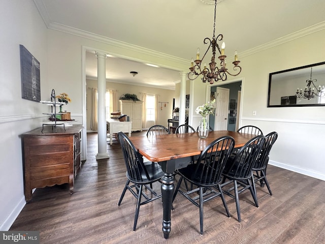 dining area with crown molding, dark wood-type flooring, and ornate columns