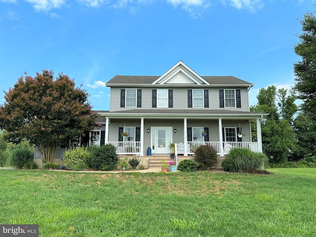 view of front of property featuring a porch and a front lawn