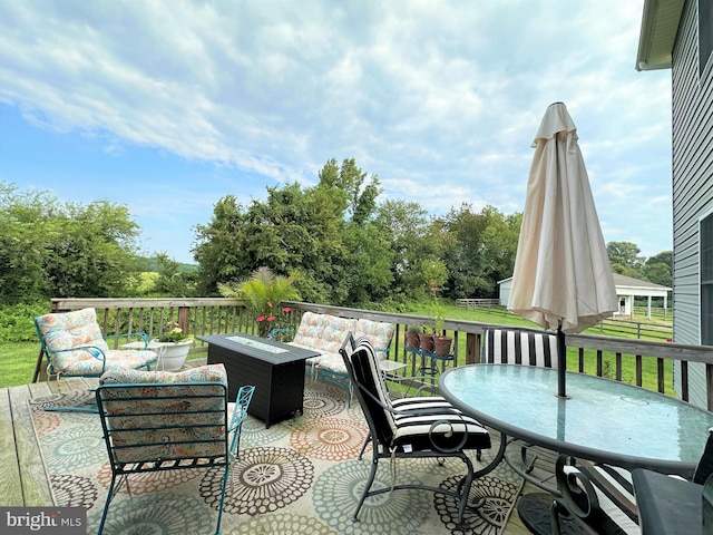 deck with outdoor dining space and an outdoor living space