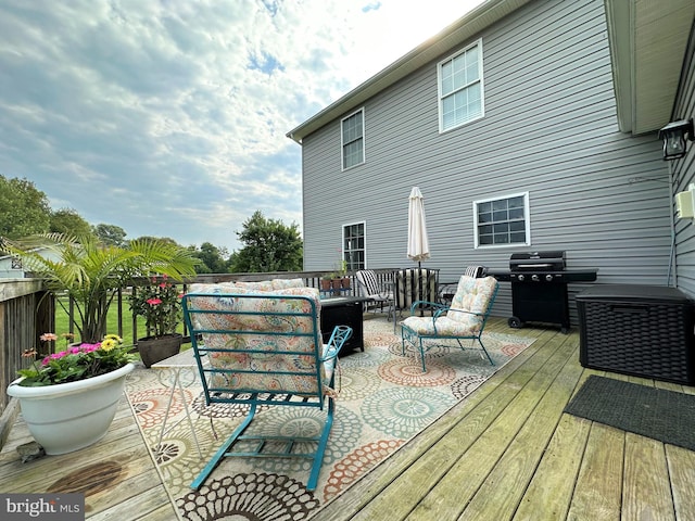 wooden deck featuring outdoor lounge area and area for grilling