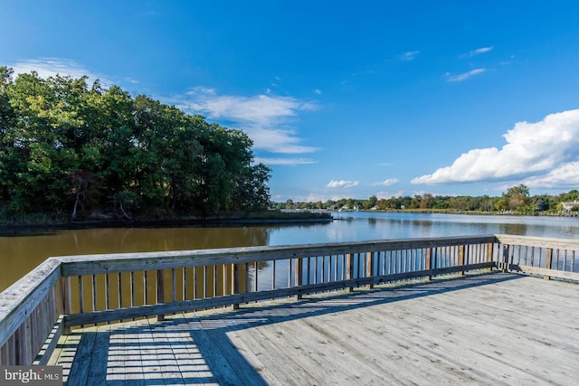 dock area with a deck with water view