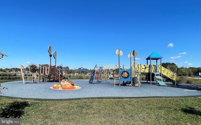 community jungle gym with a yard