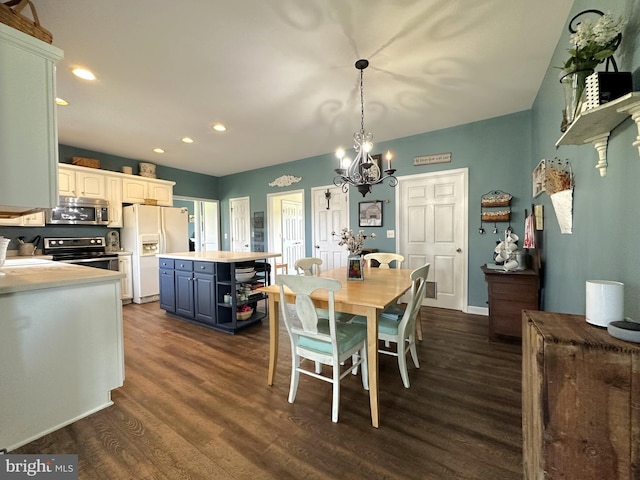 dining space featuring a notable chandelier, dark wood-type flooring, and recessed lighting