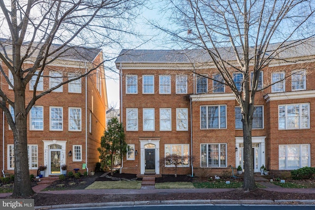 view of property with brick siding