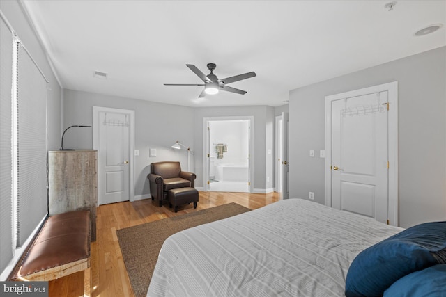 bedroom with visible vents, baseboards, light wood-style flooring, and a ceiling fan