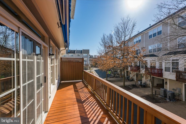 balcony featuring central air condition unit and a residential view