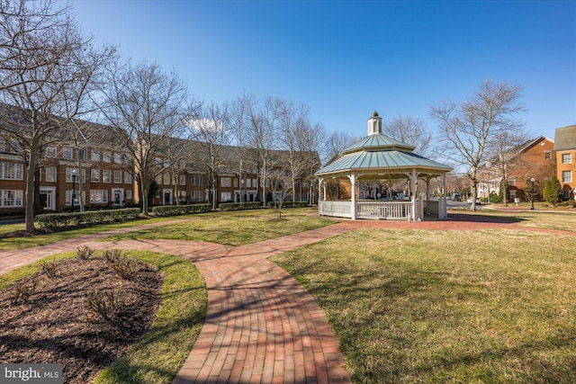 surrounding community featuring a gazebo, a residential view, and a lawn