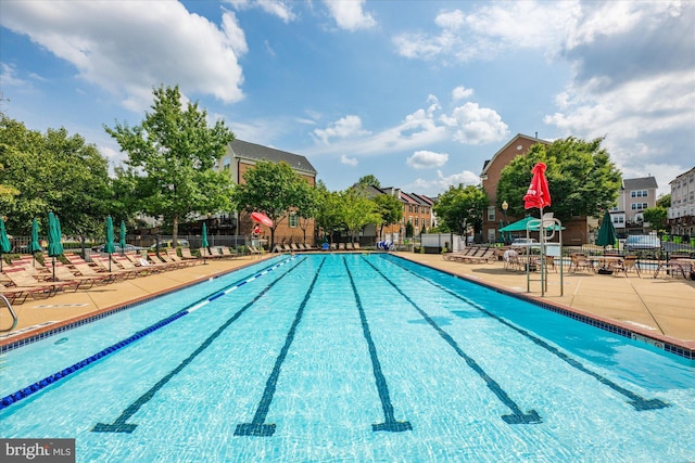 pool featuring a patio area and fence