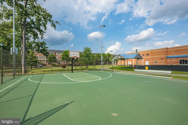 view of sport court featuring community basketball court and fence