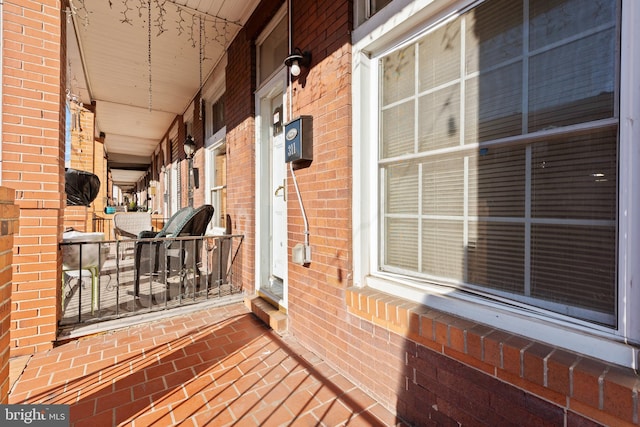 wooden terrace featuring a porch