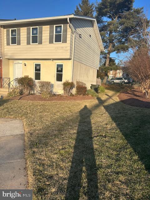 view of home's exterior with a yard and stucco siding